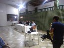 Mesa de debates durante apresentação.